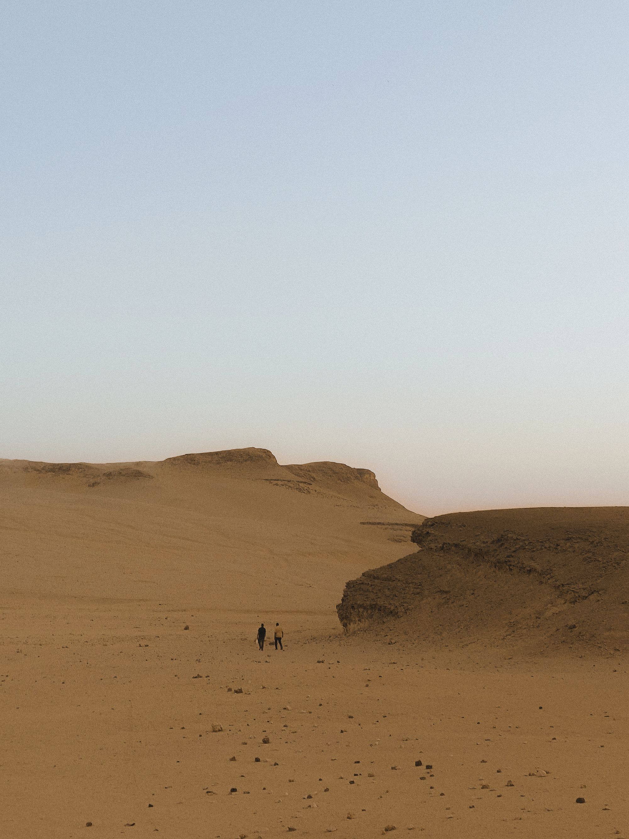 Travelers crossing an open Egyptian landscape