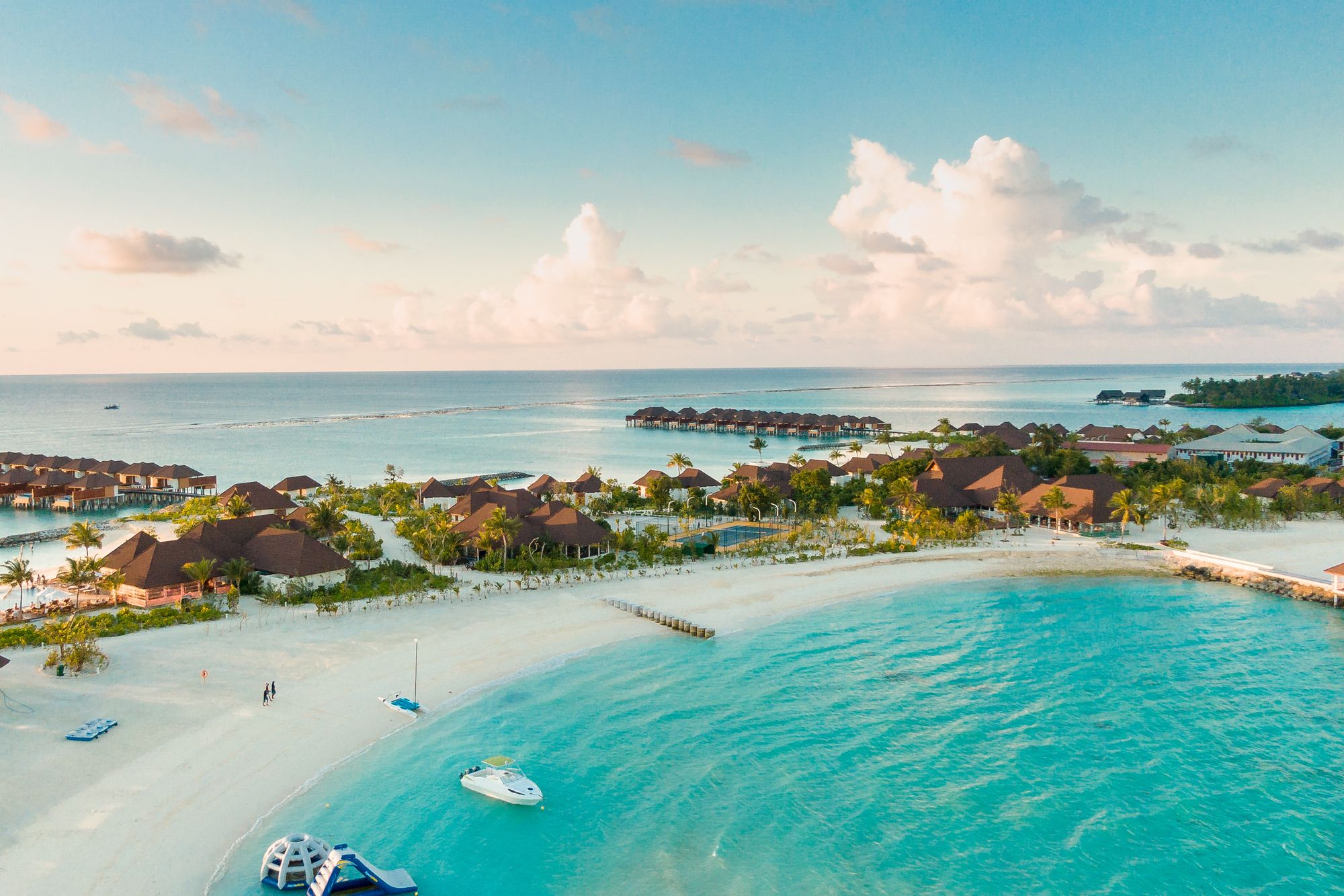 Clear turquoise water beside a quiet shoreline